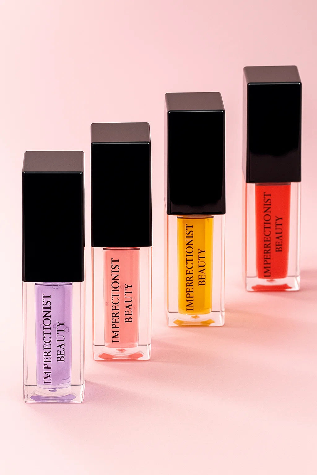 Four lip gloss bottles from Imperfectionist Beauty on a pink background