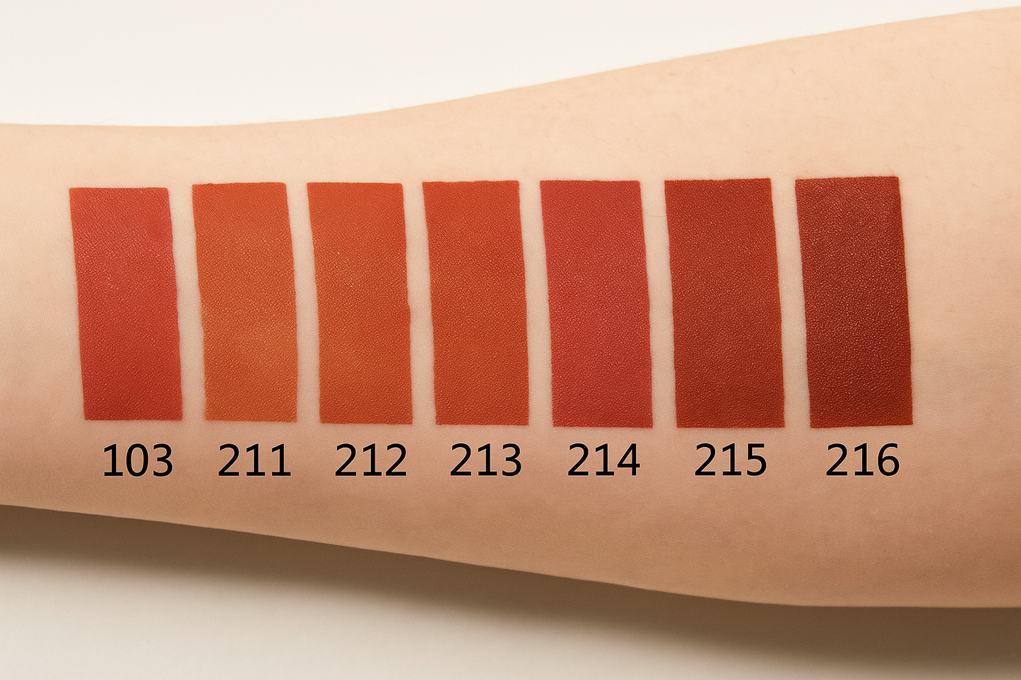 Color swatches on a person's arm with numbers indicating color codes.