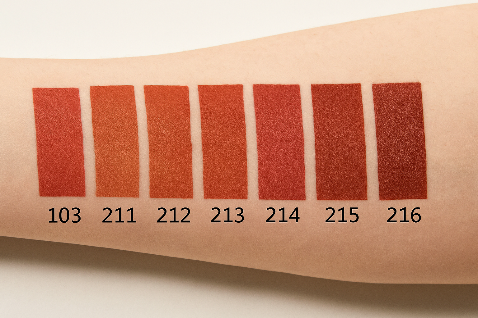 Color swatches on a person's arm with numbers indicating color codes.